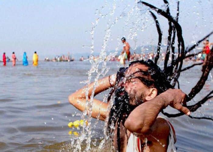 Sadhu taking bath in Ganga